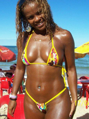 Afro girl on a beach. She's a sexy and very hot